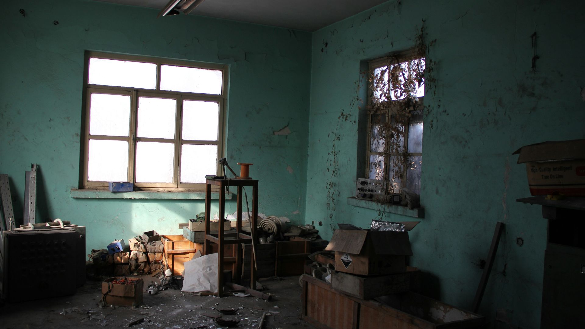 a room with a few boxes and a window