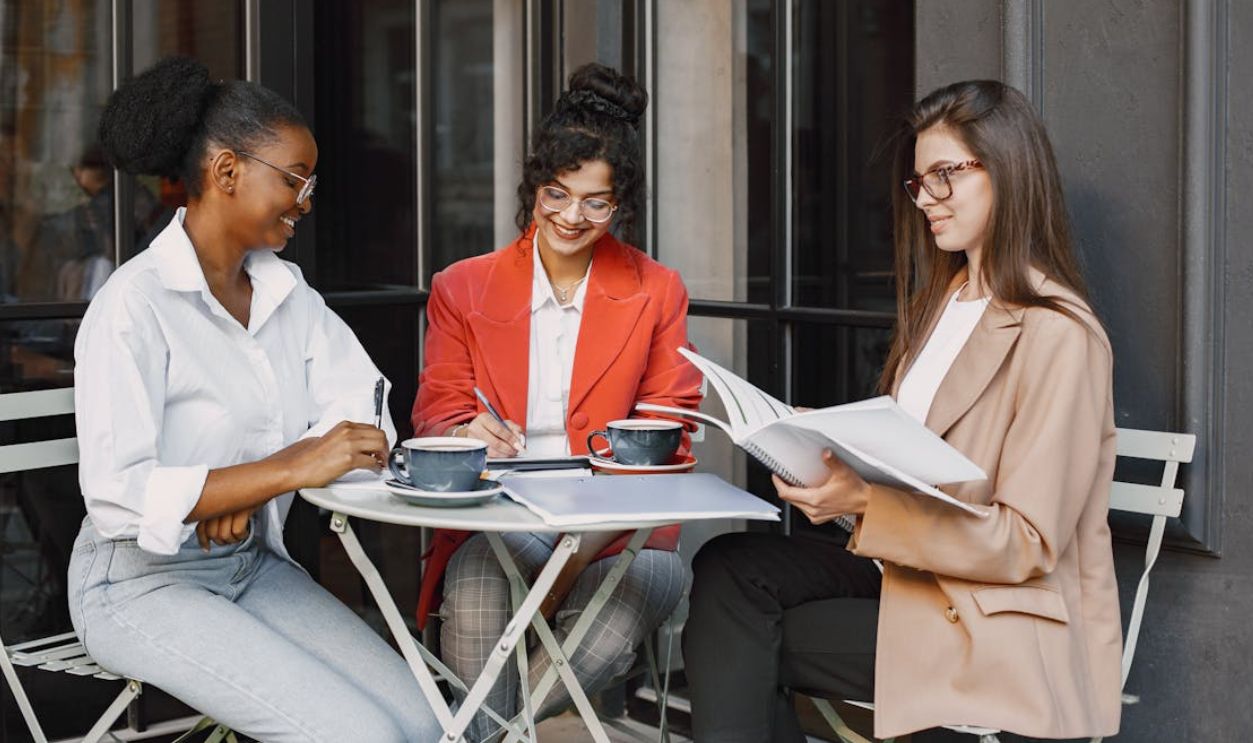 Women Having Meeting while in the Coffee Shop