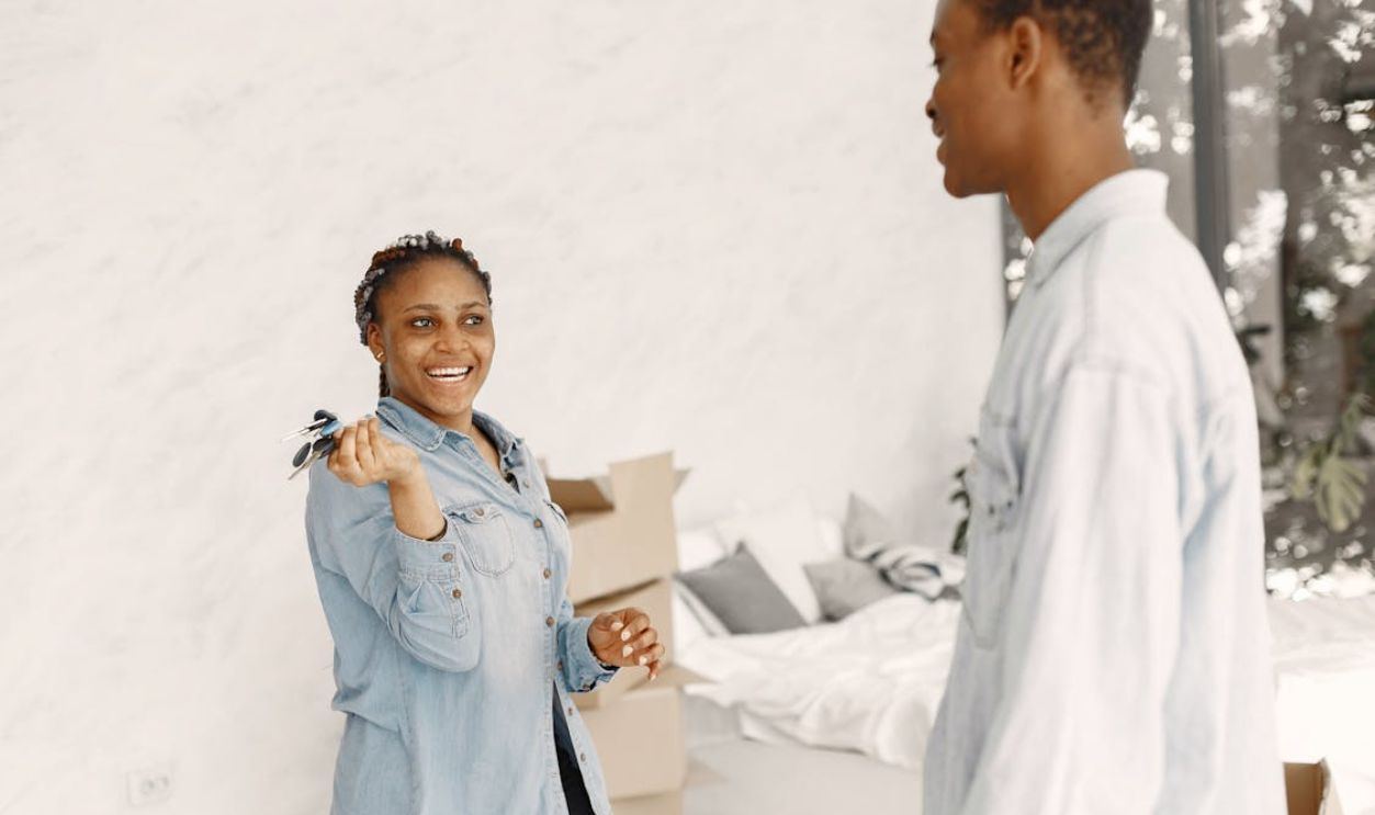 A Happy Woman Holding a Bunch of Keys