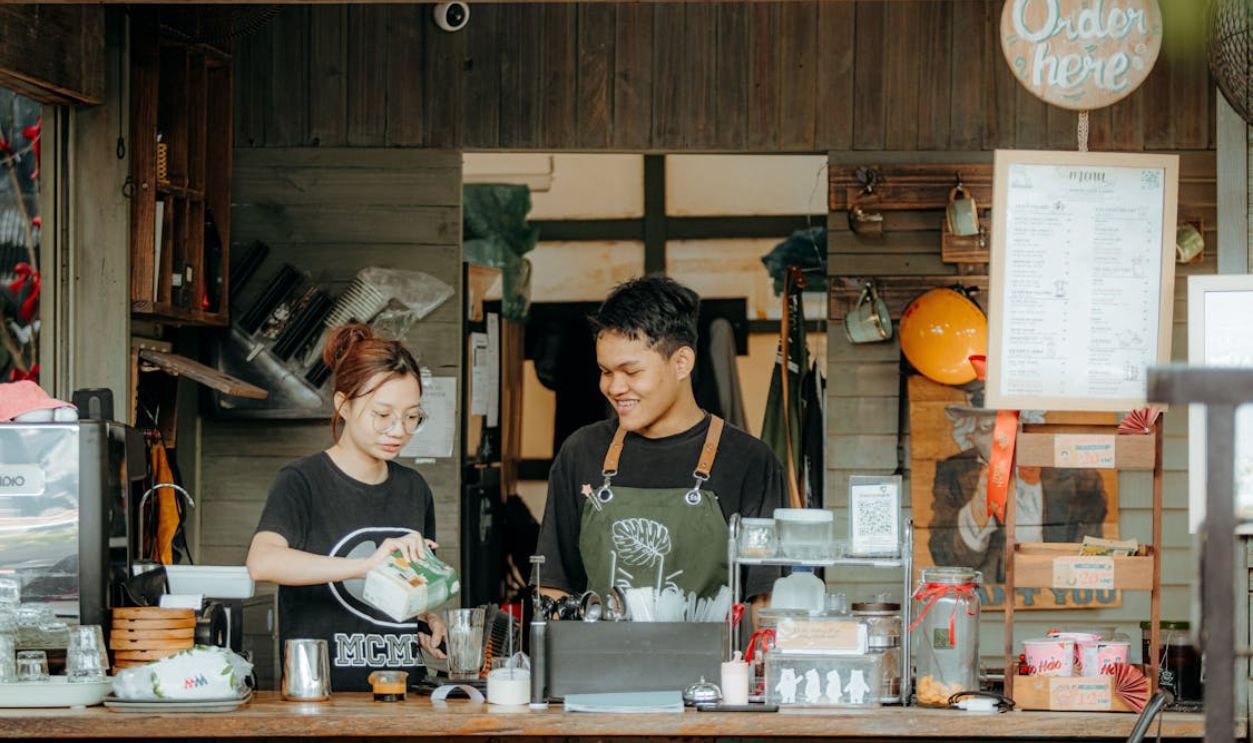 Friendly Cafe Staff at Work Behind Counter