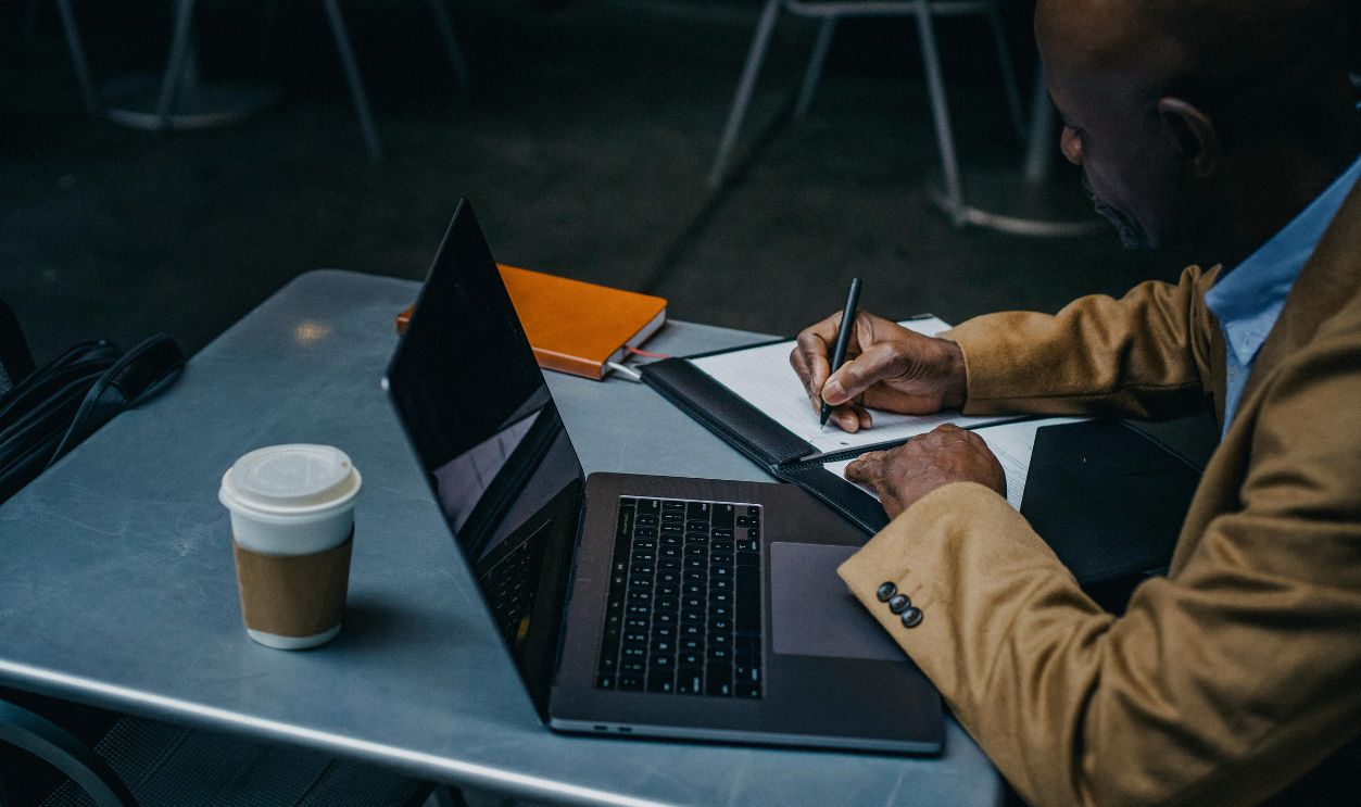 African American entrepreneur working in cafeAfrican American entrepreneur working in cafe