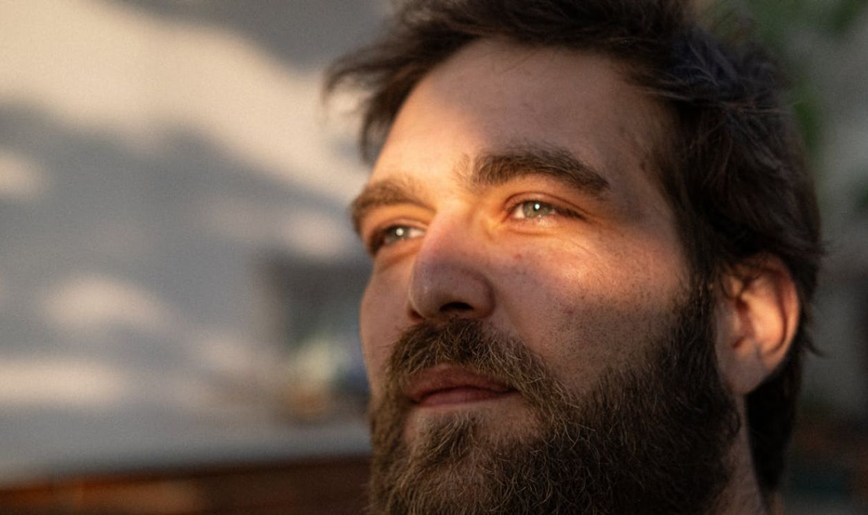 Golden Hour Portrait of Reflective Man Outdoors