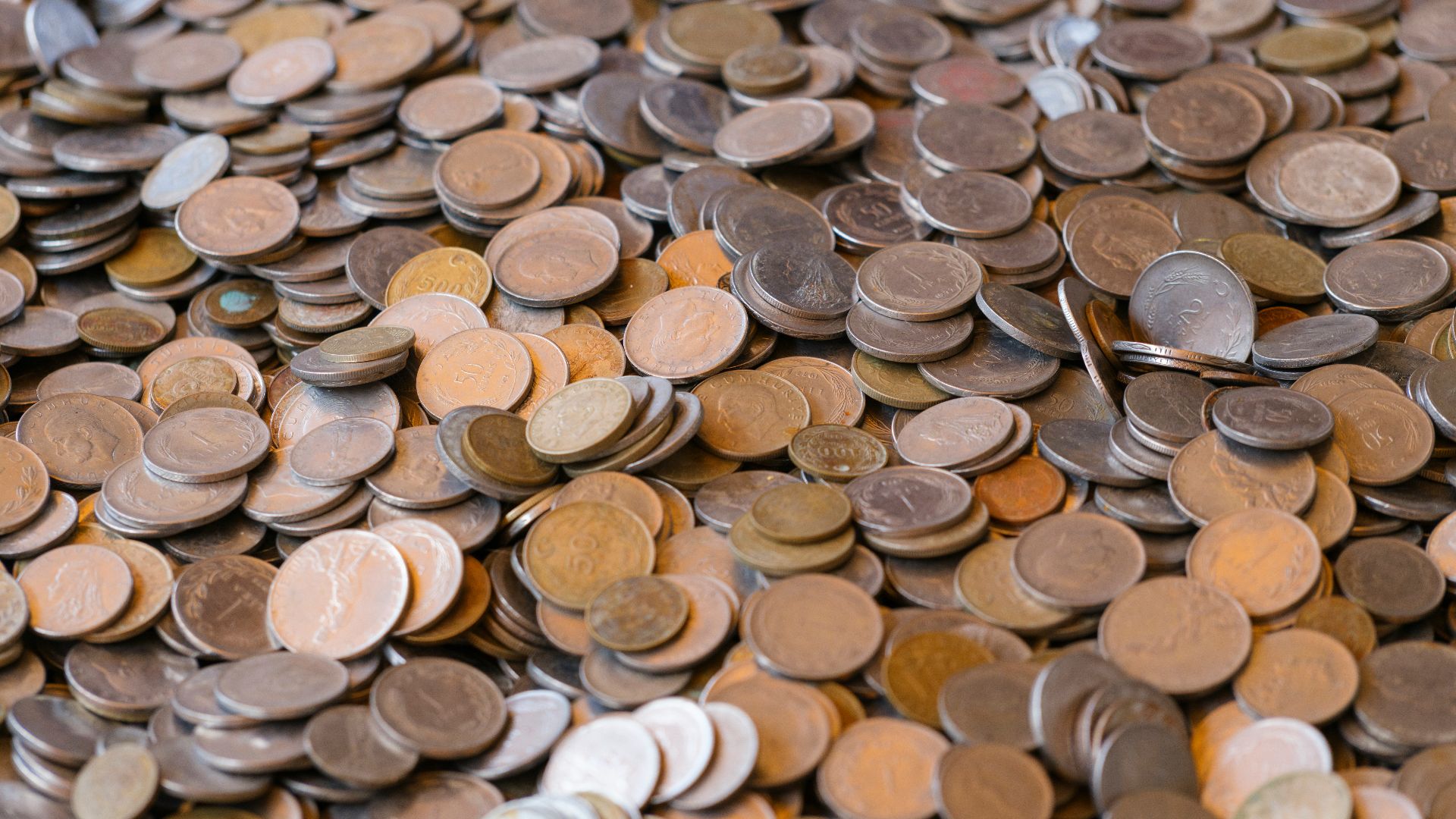 A large pile of various coins.