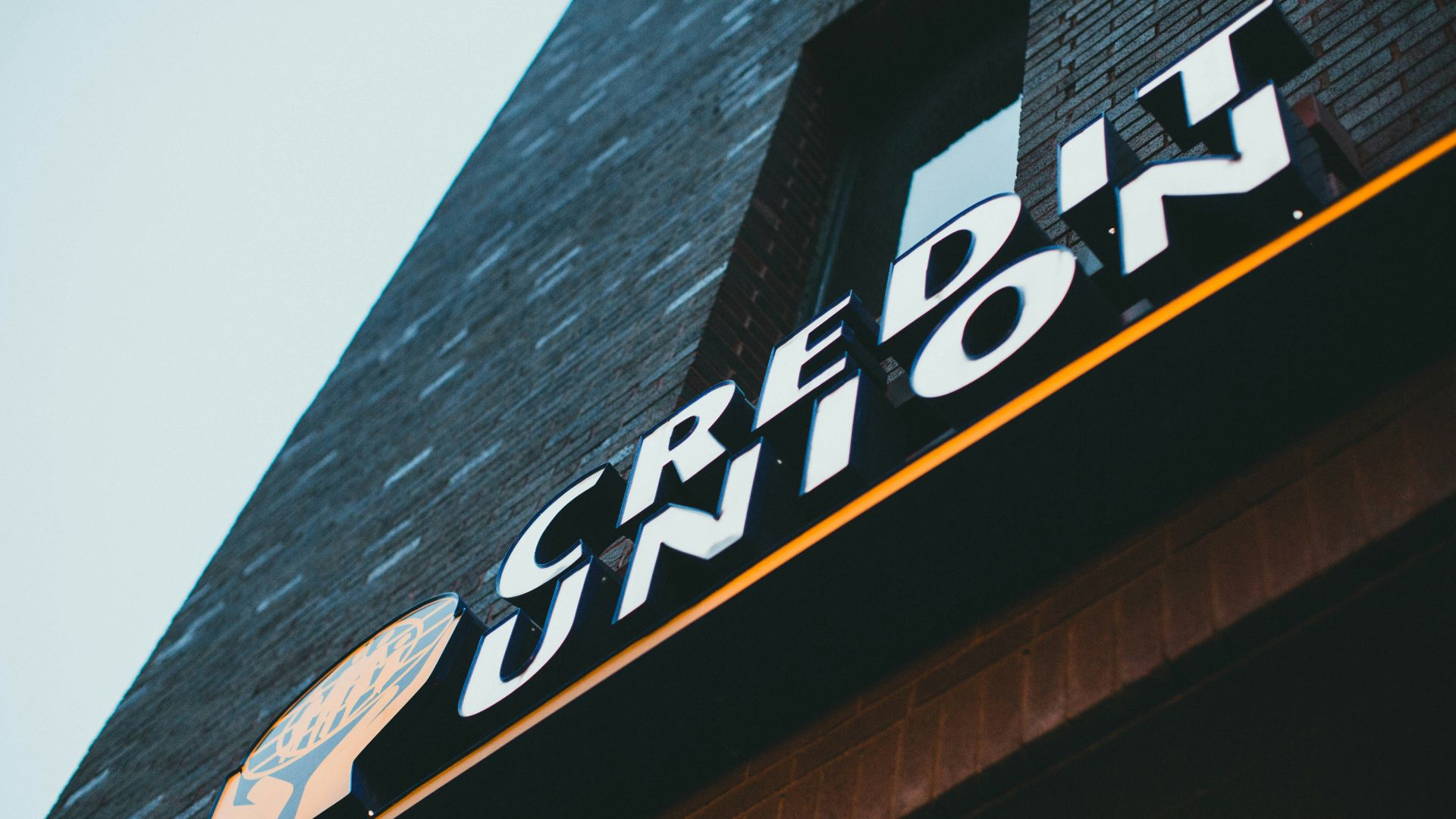 a sign on the side of a brick building