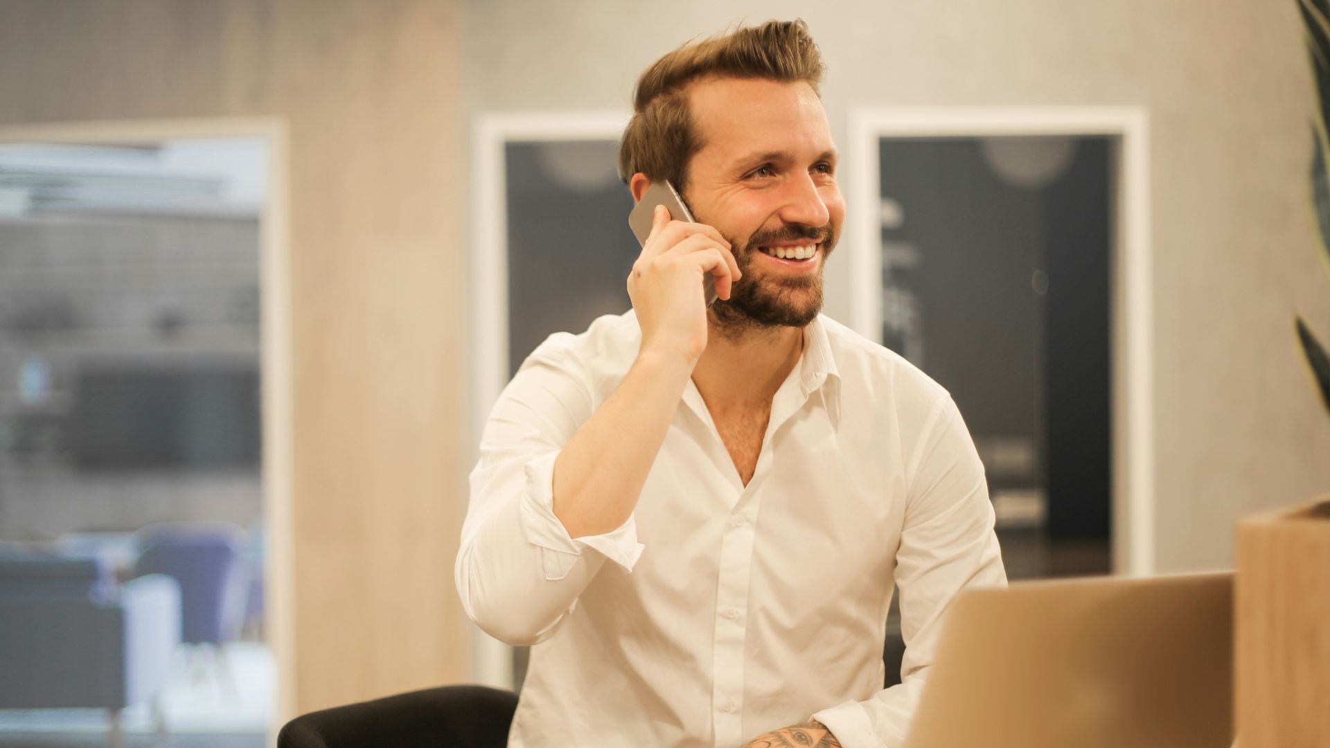 man using smartphone on chair