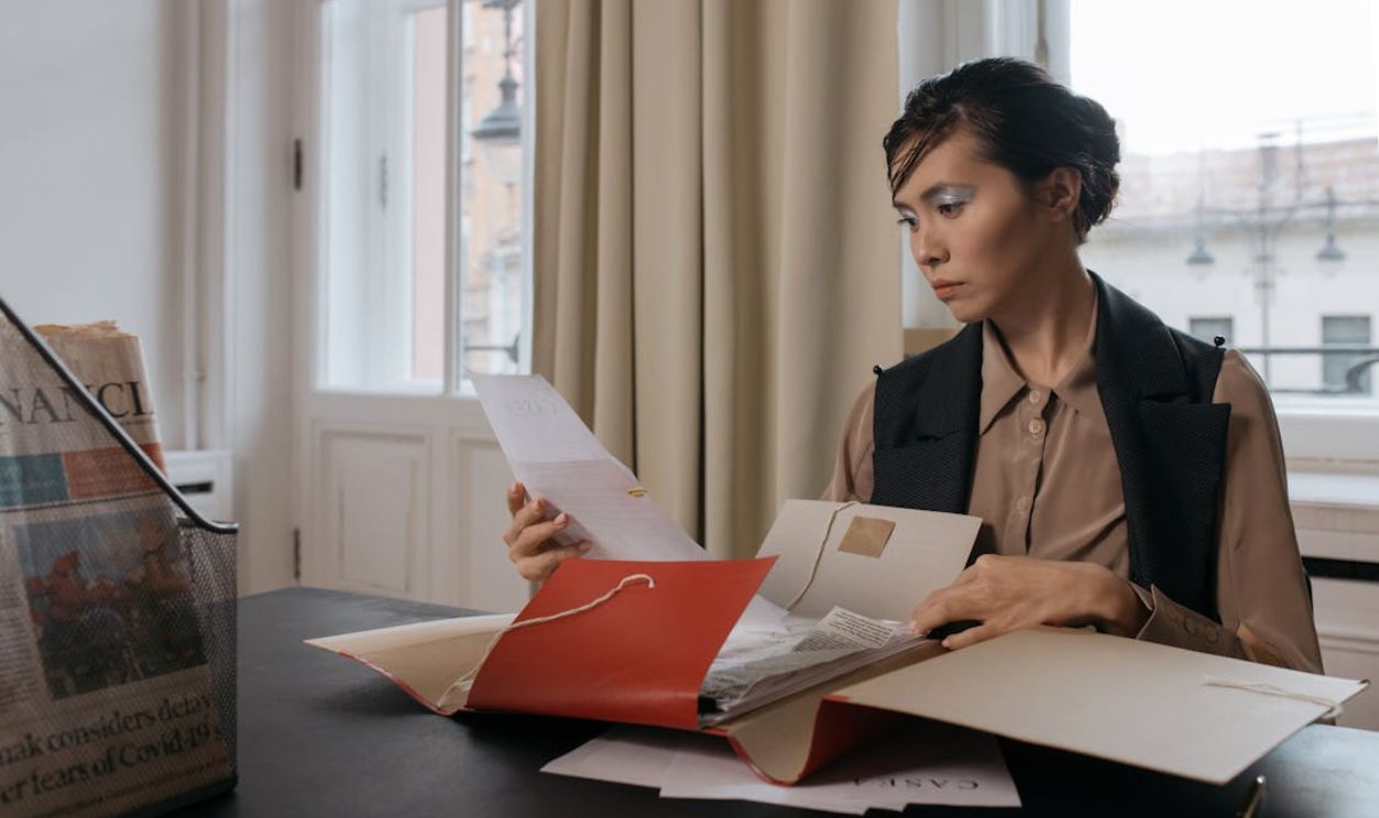 A Woman Holding Documents