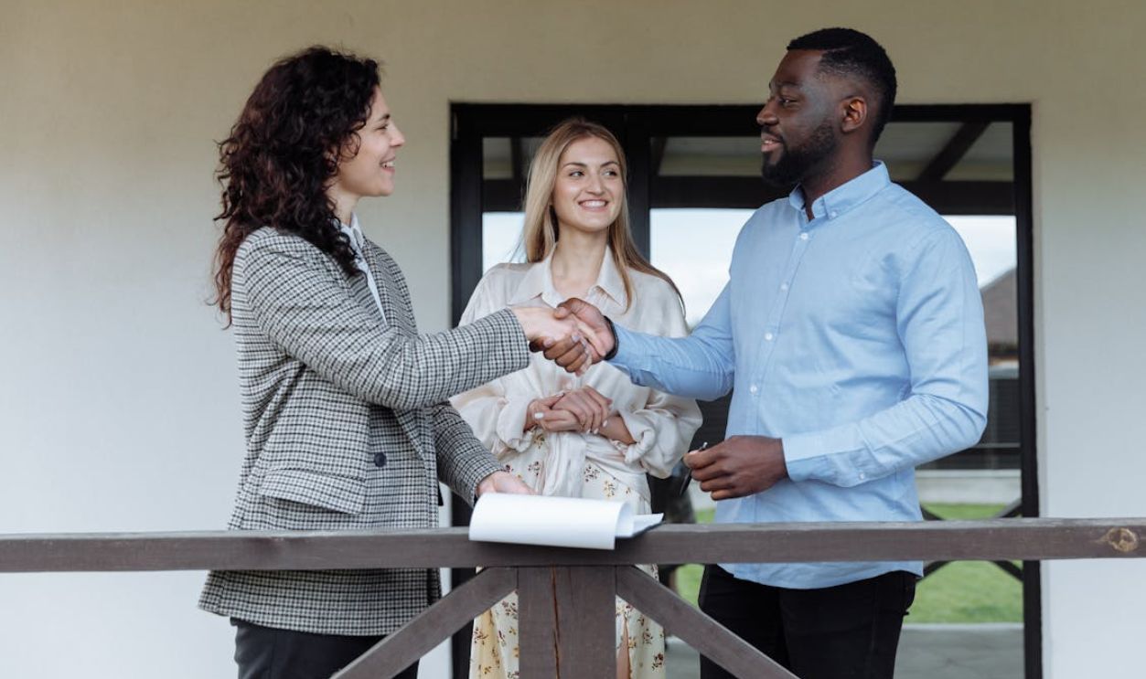 A Man and a Woman Shaking Each Others Hands
