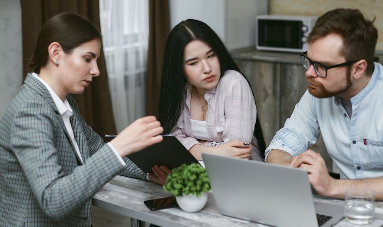 Group of People Discussing Notes Together