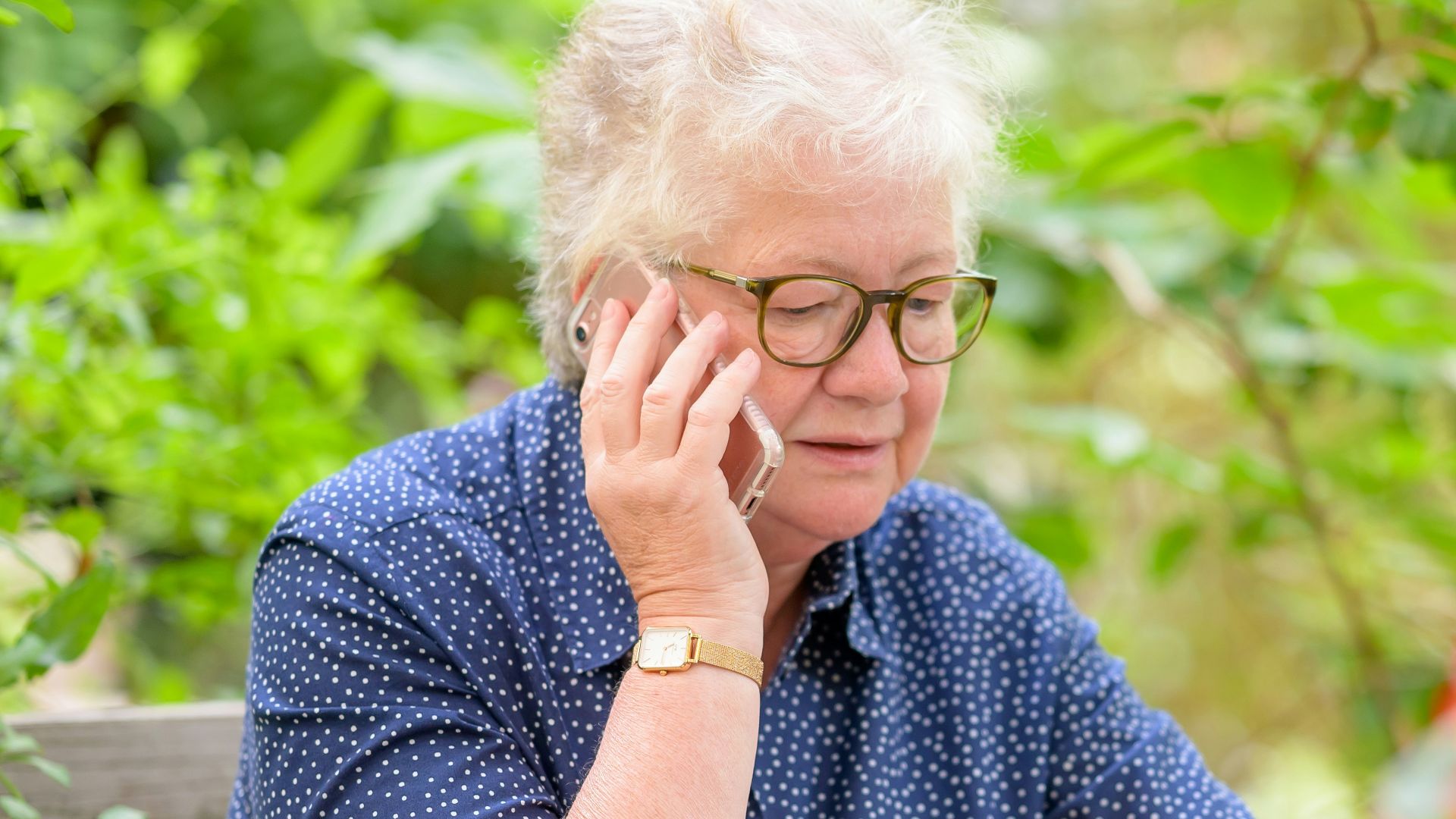 an old woman using a laptop