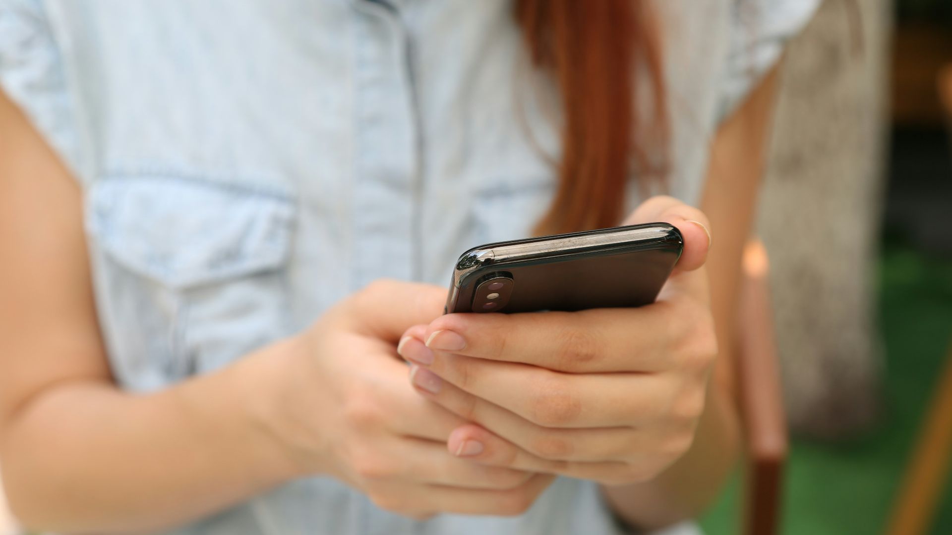 person holding using iPhone X