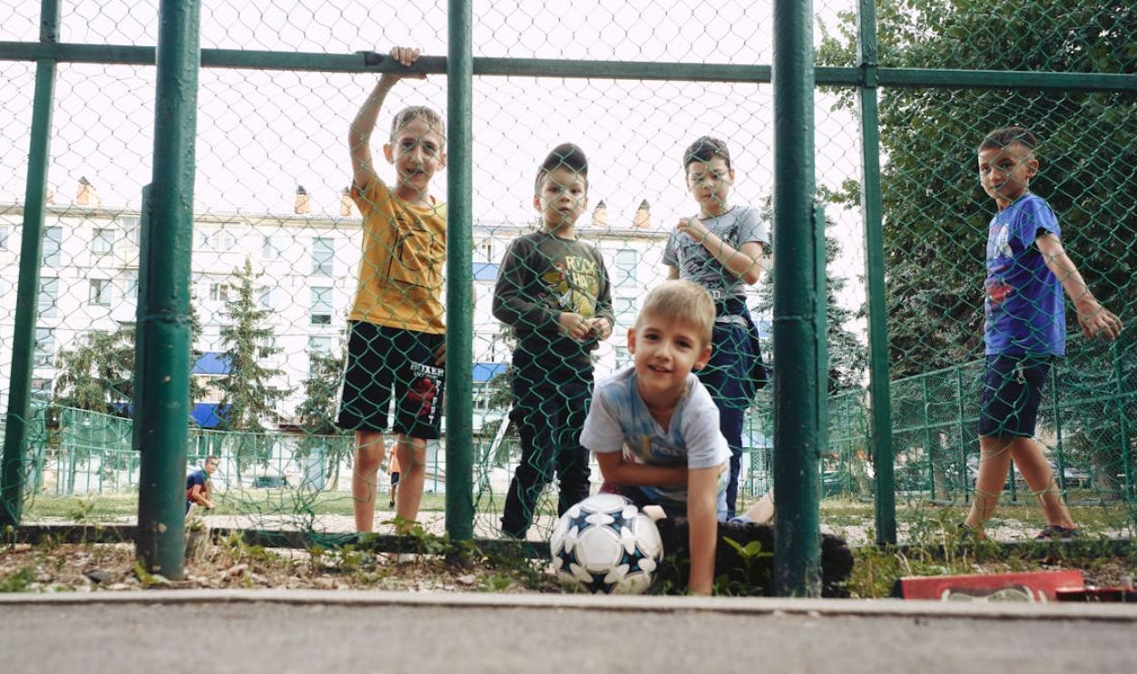 Kids near a Fence