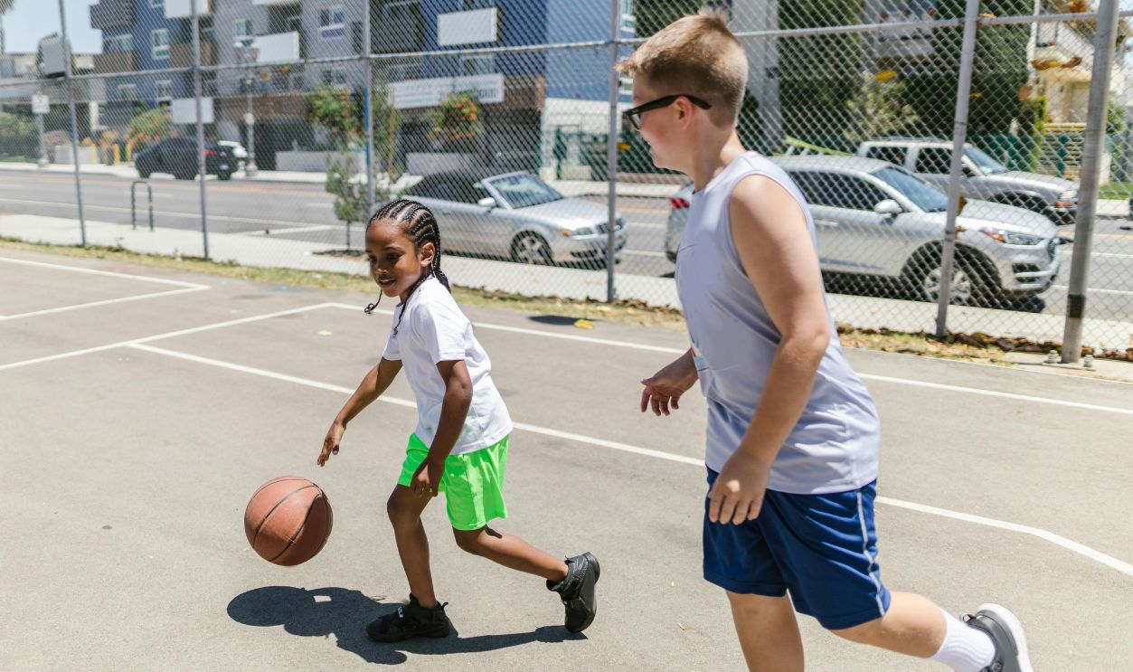 Boys Playing Basketball on Court