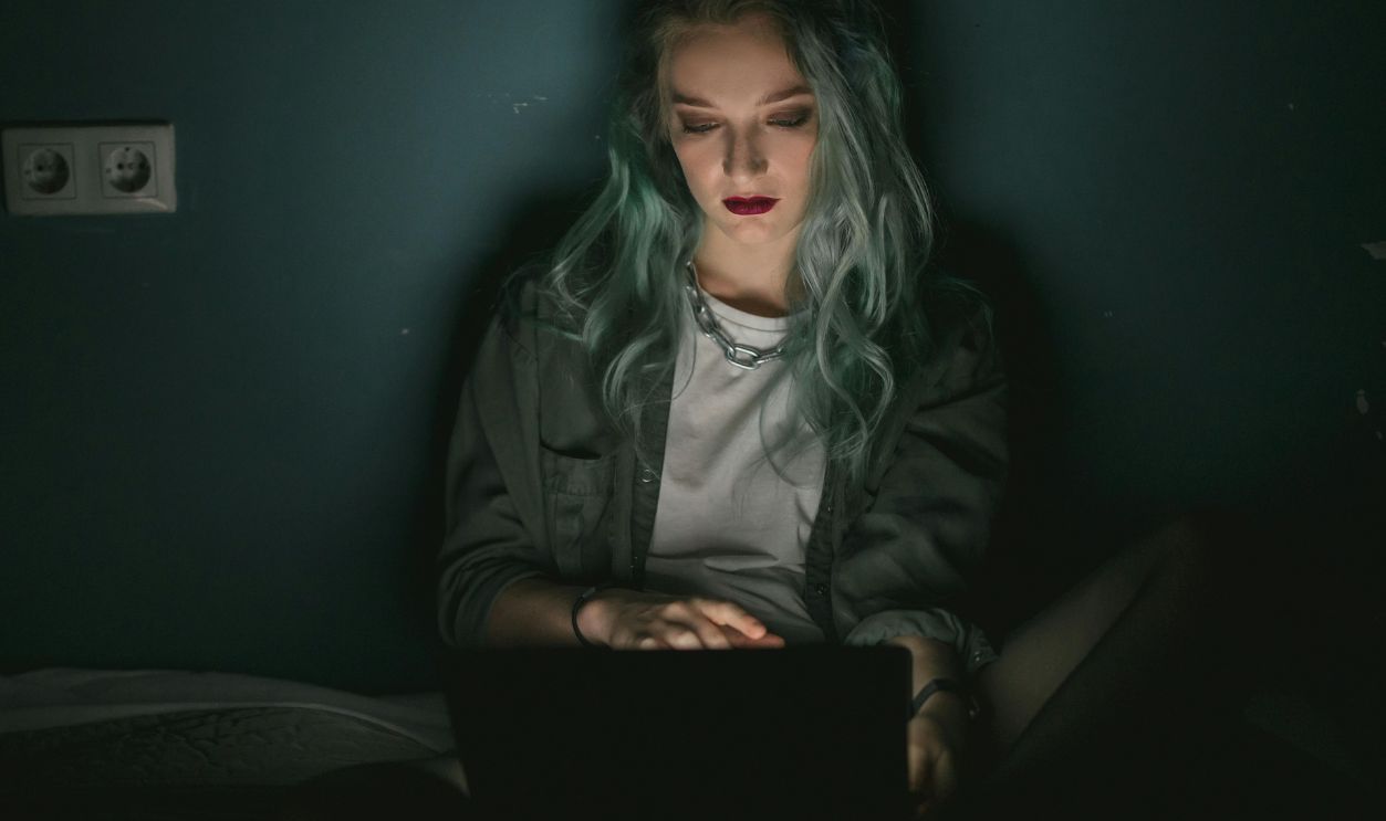 Woman Using a Laptop in the Dark