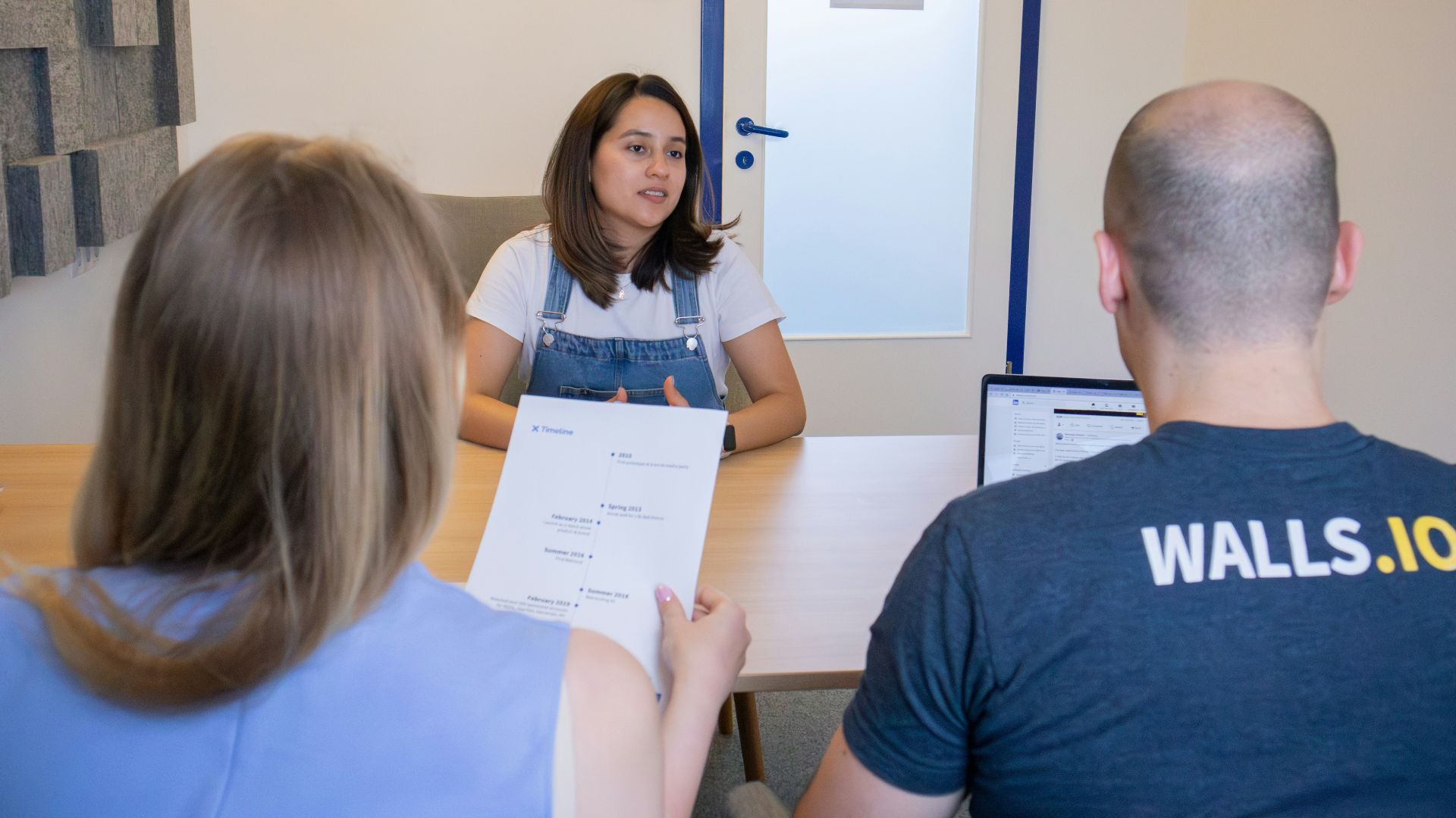 a group of people sitting around a table
