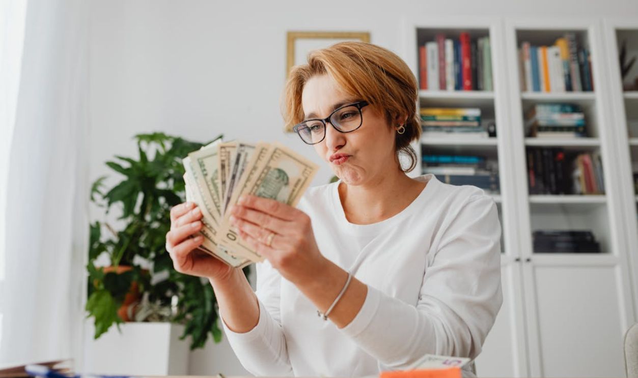Woman Counting the Money