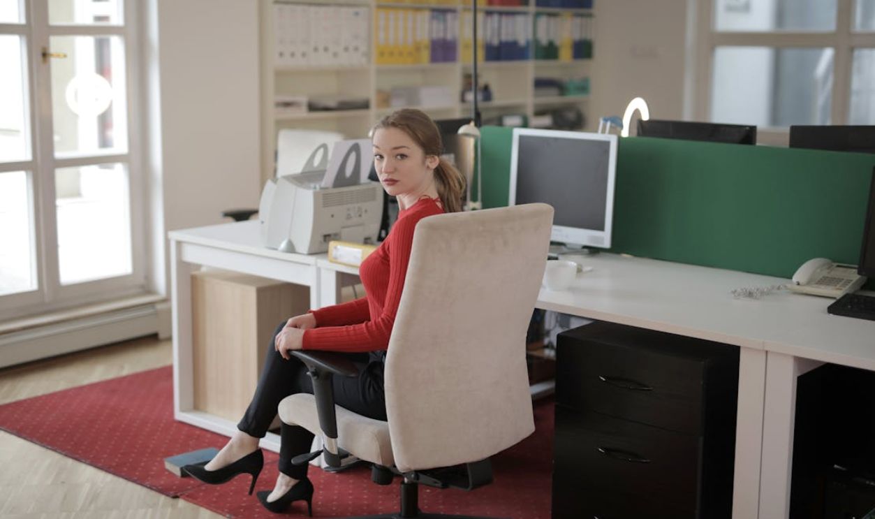Woman Sitting on an Office Chair