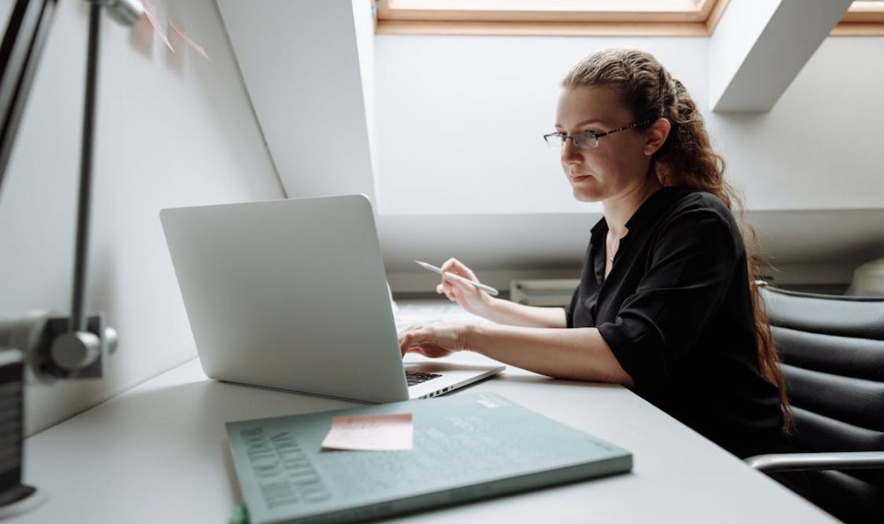 Close-up Photo of Female Architect using Laptop