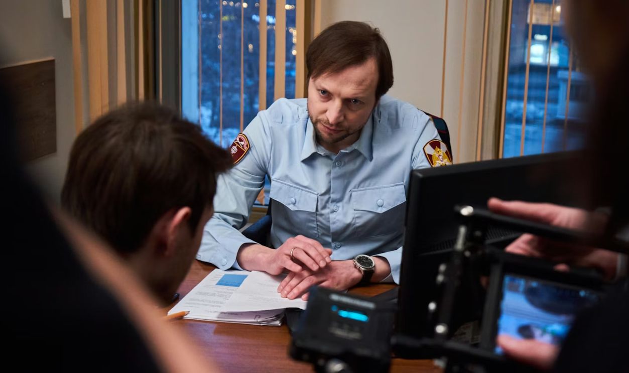 Police officer talking to someone or taking a report