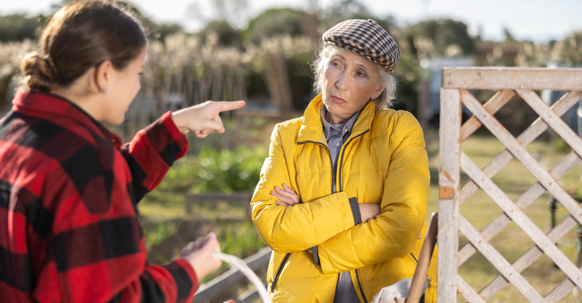 Two upset young and old female neighbors disagree