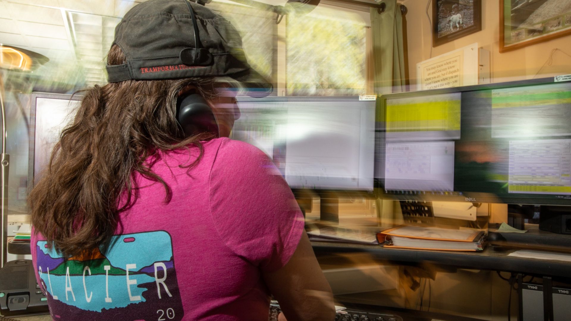 A Public Safety Dispatcher answers the phone at her desk. Dispatch works to keep visitors and staff safe by responding to calls and emergencies.