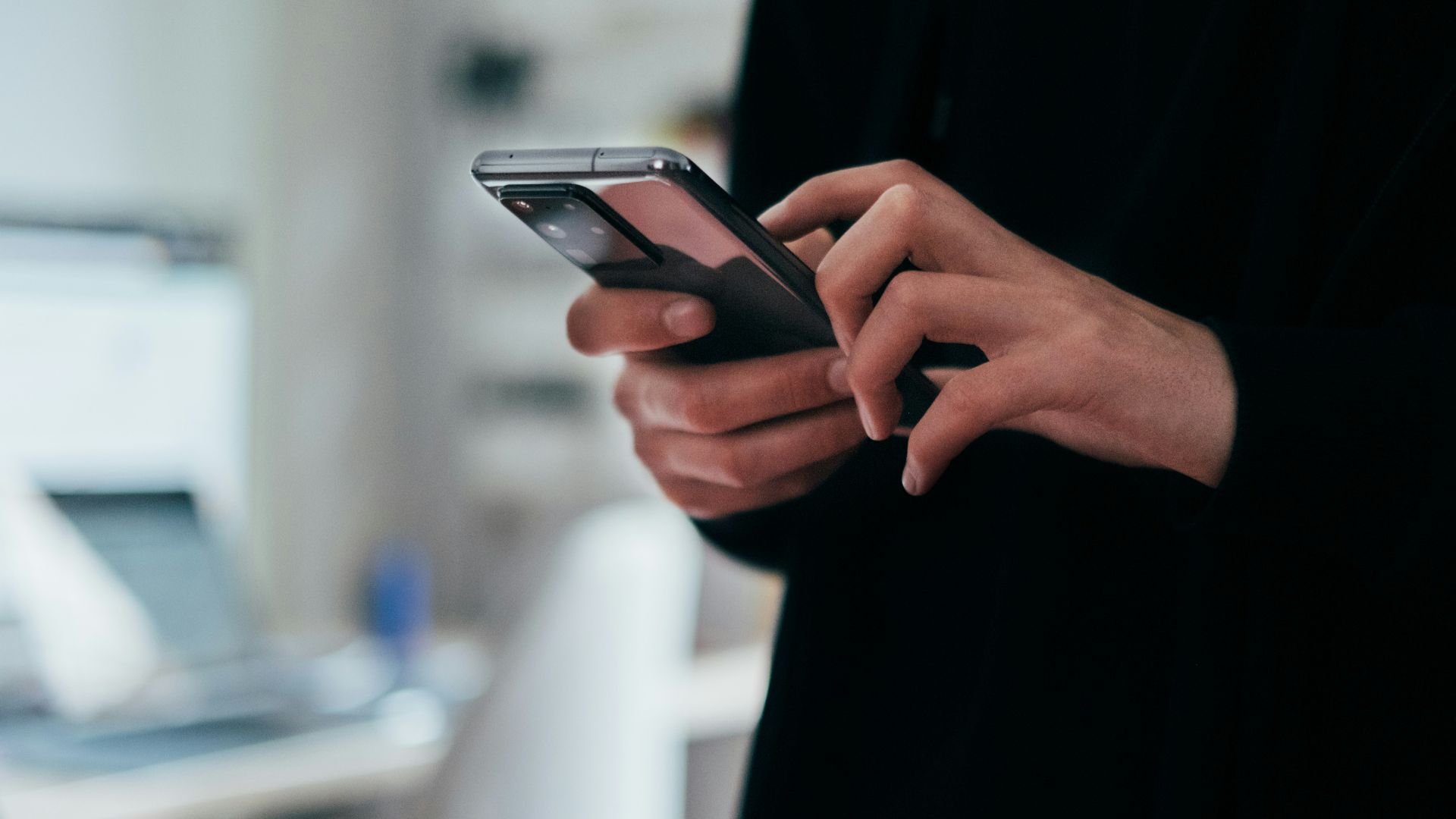 person holding black android smartphone