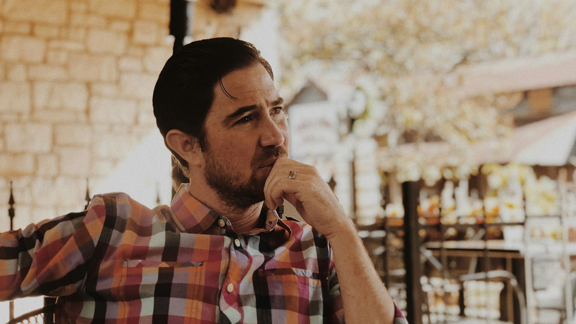 man in red and black plaid dress shirt