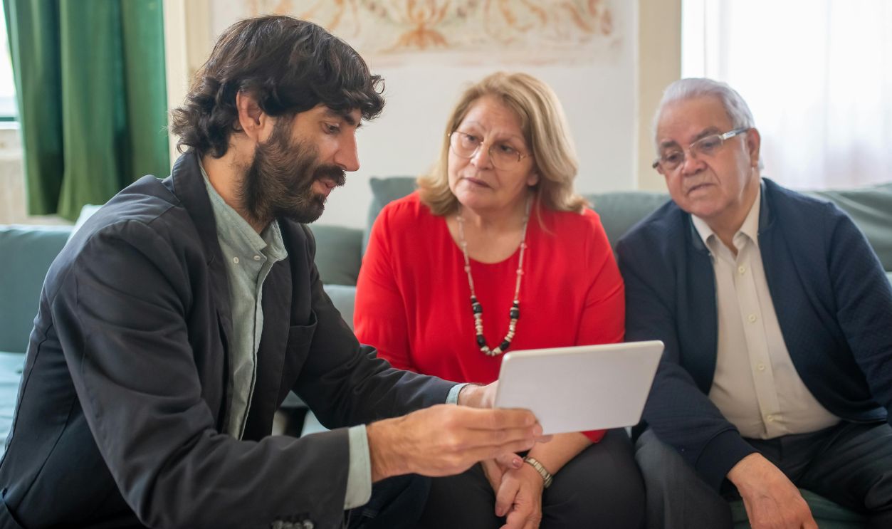 A financial advisor discussing investment options with an elderly couple