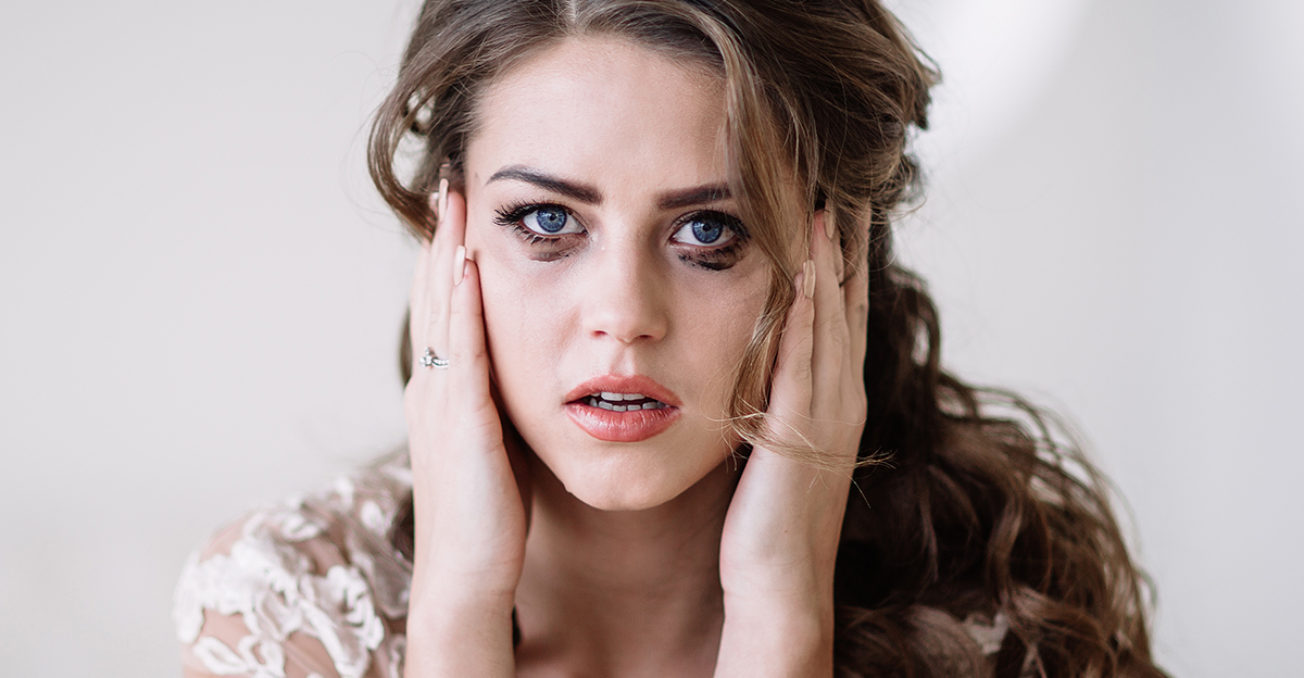 portrait of the bride crying, sadness, streaks of ink. Natural light