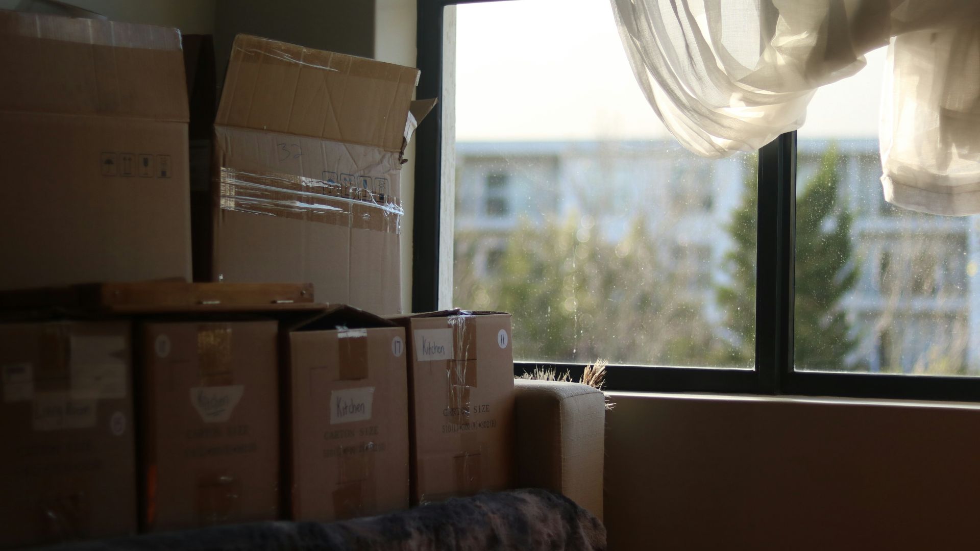 a room with boxes and a window
