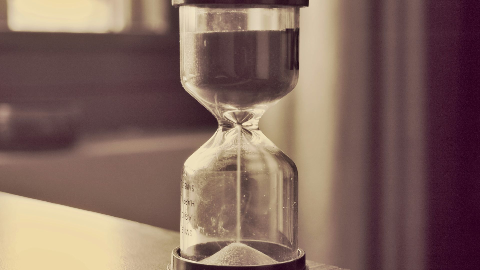An hourglass counts down time.