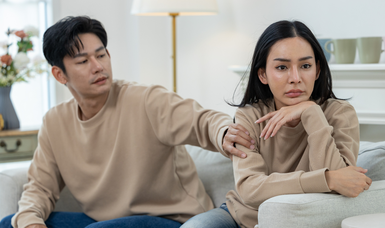 A couple sitting on a couch
