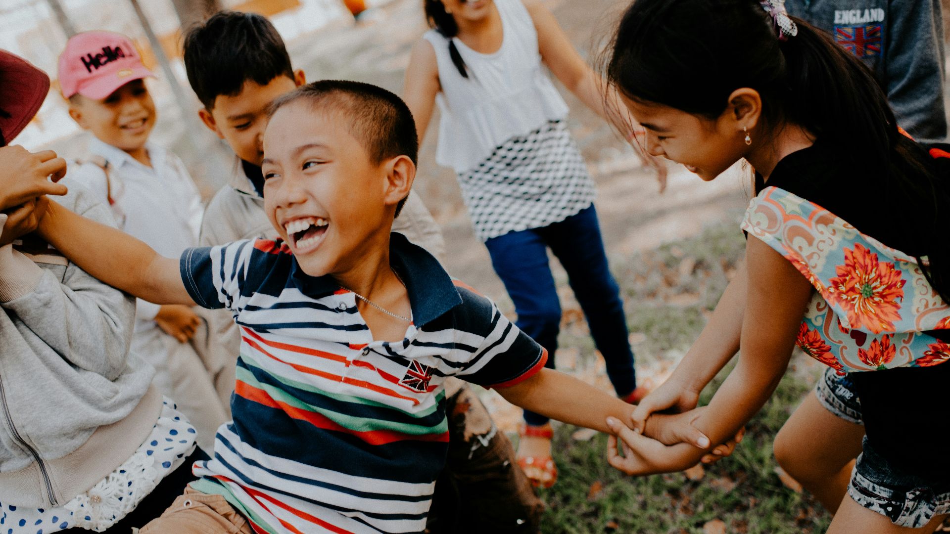 children playing on grass field