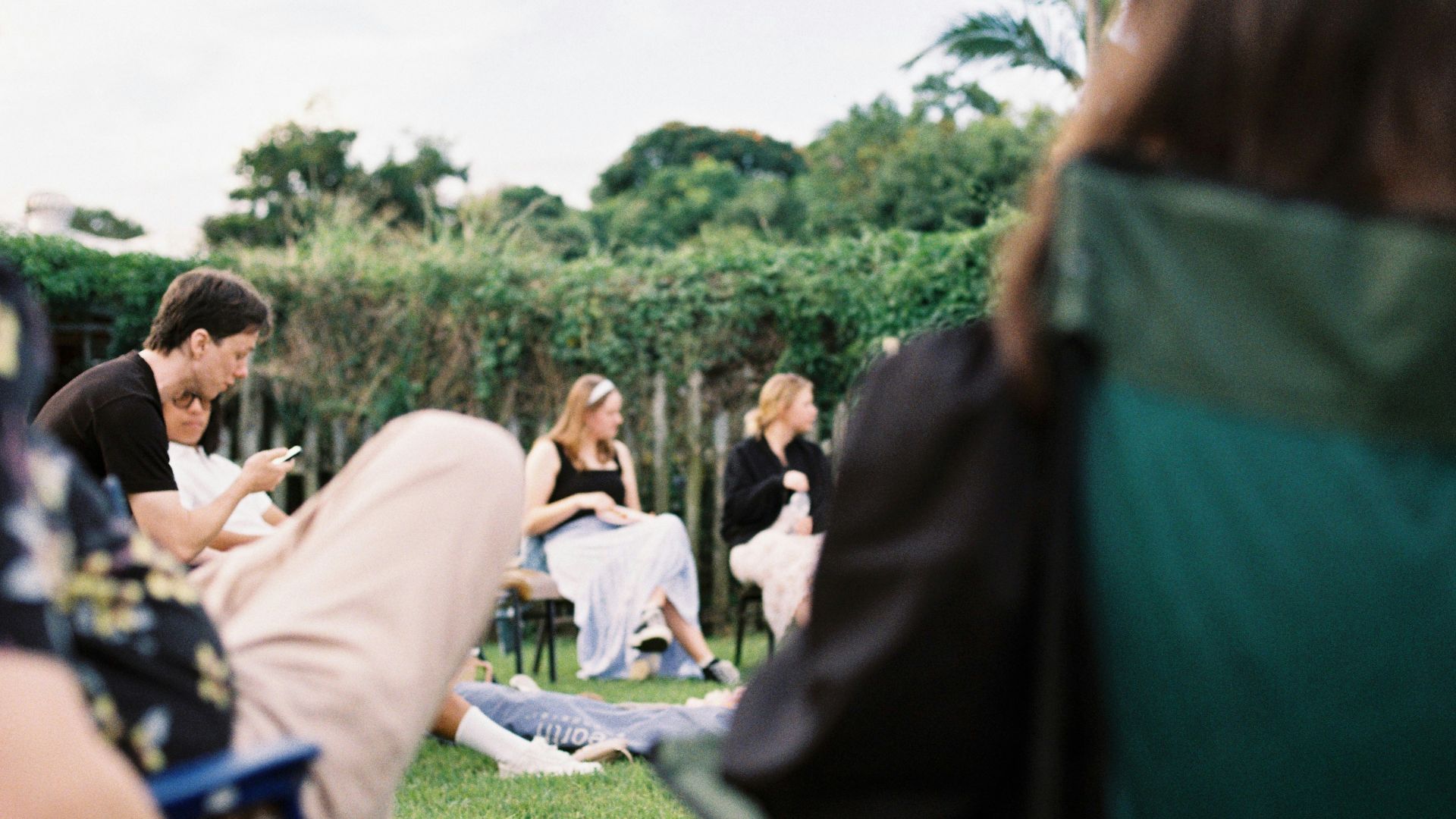 People gathered outdoors on a sunny day.
