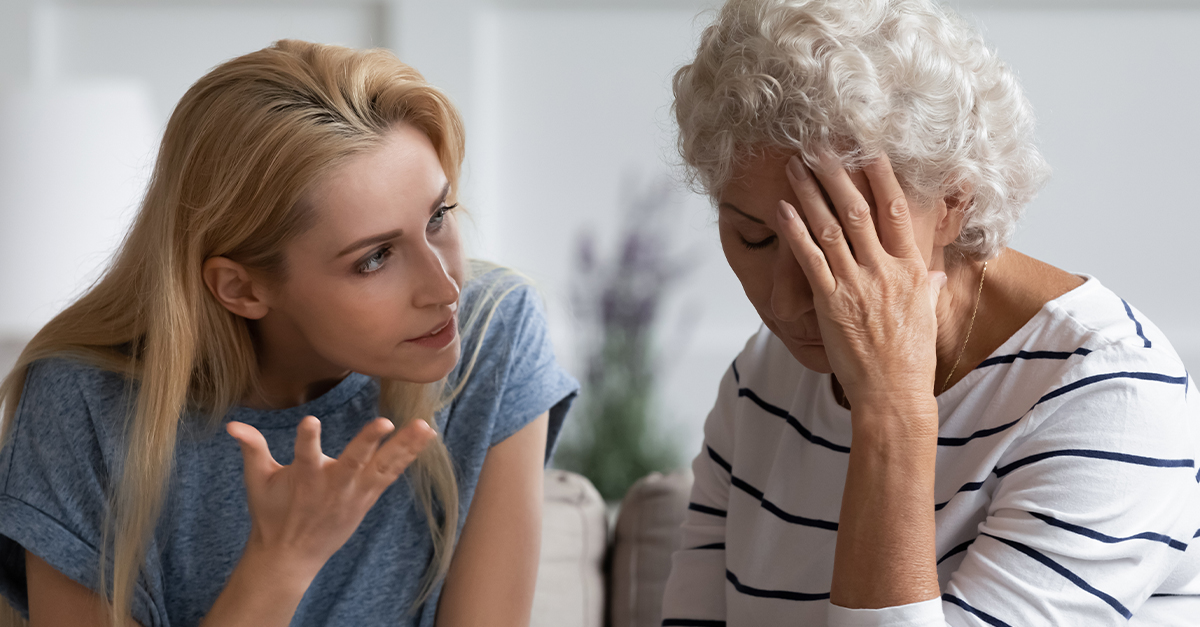A daughter and elderly mother having an argument.