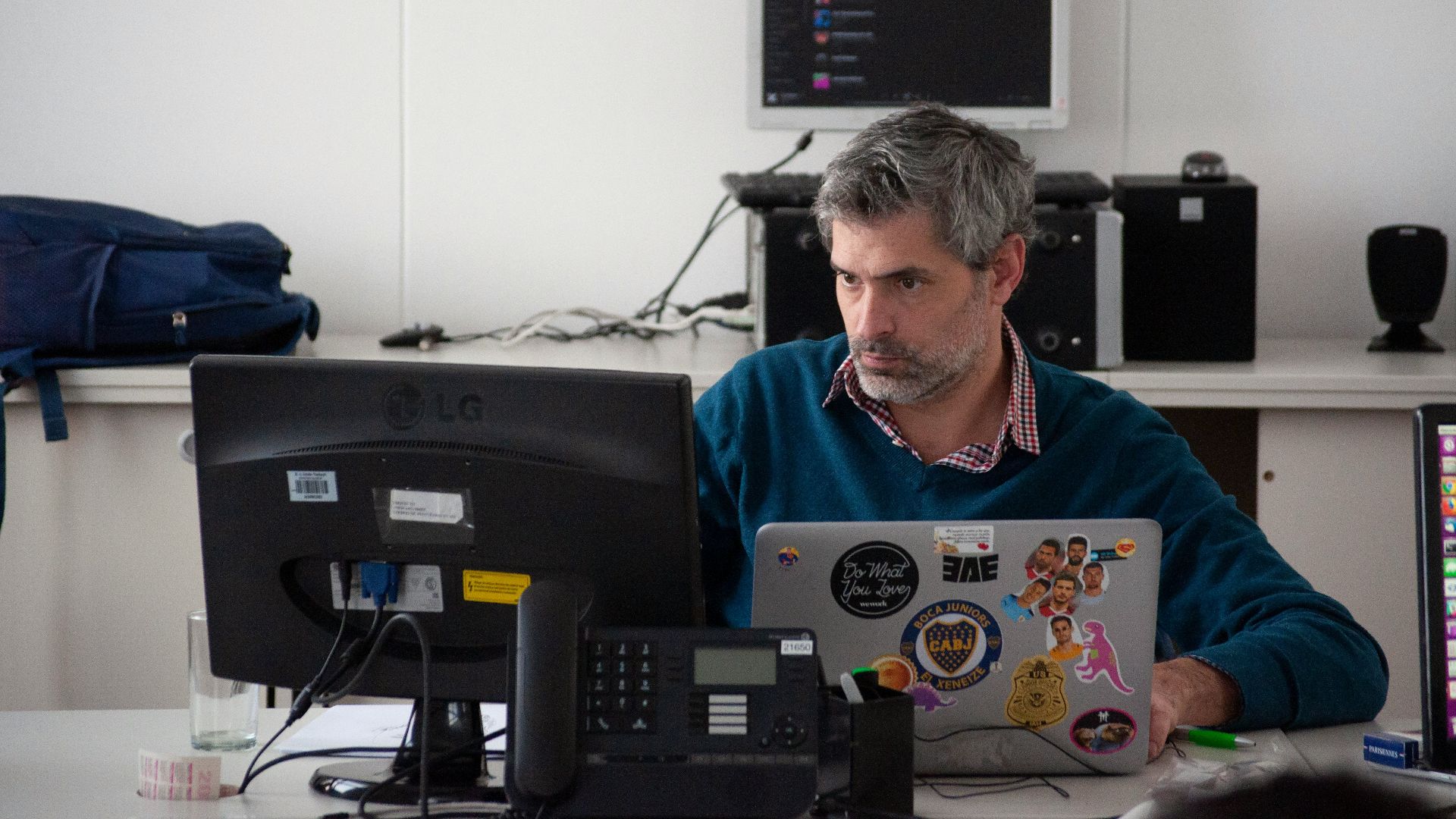 man sitting beside desk