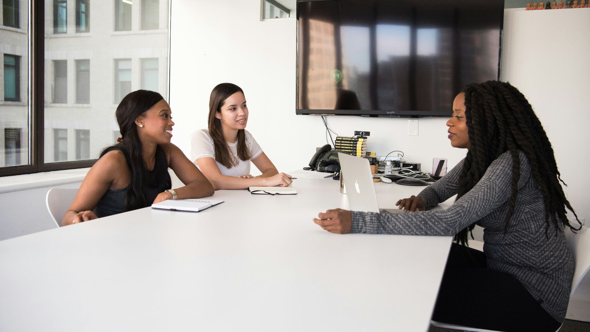 three women sitting at the table