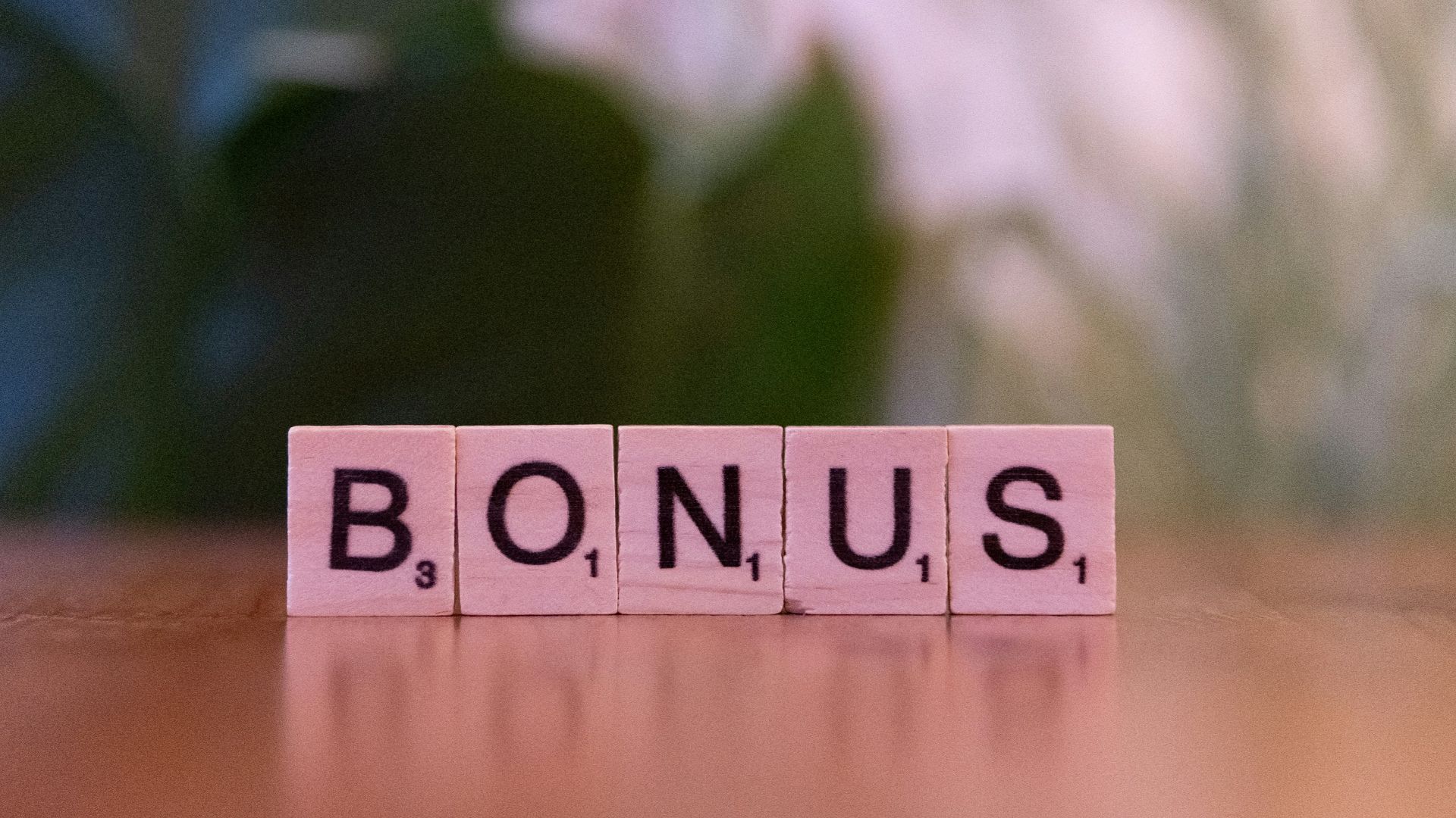 A close up of a scrabble type word on a table