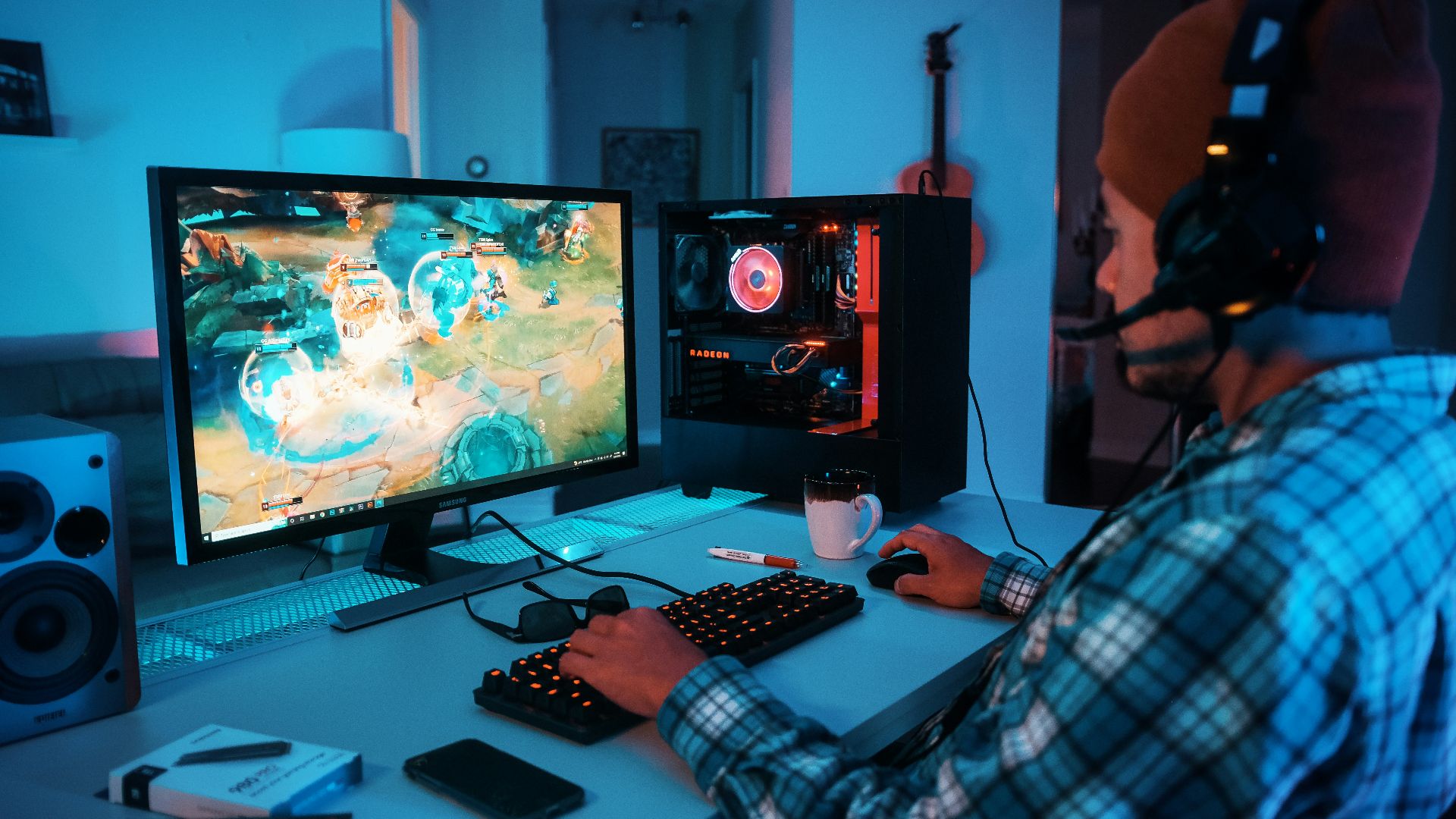 a person wearing headphones and using a computer