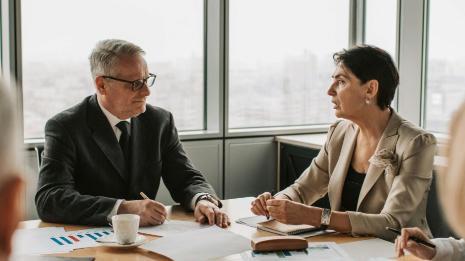 Man and woman discussing business in a meeting