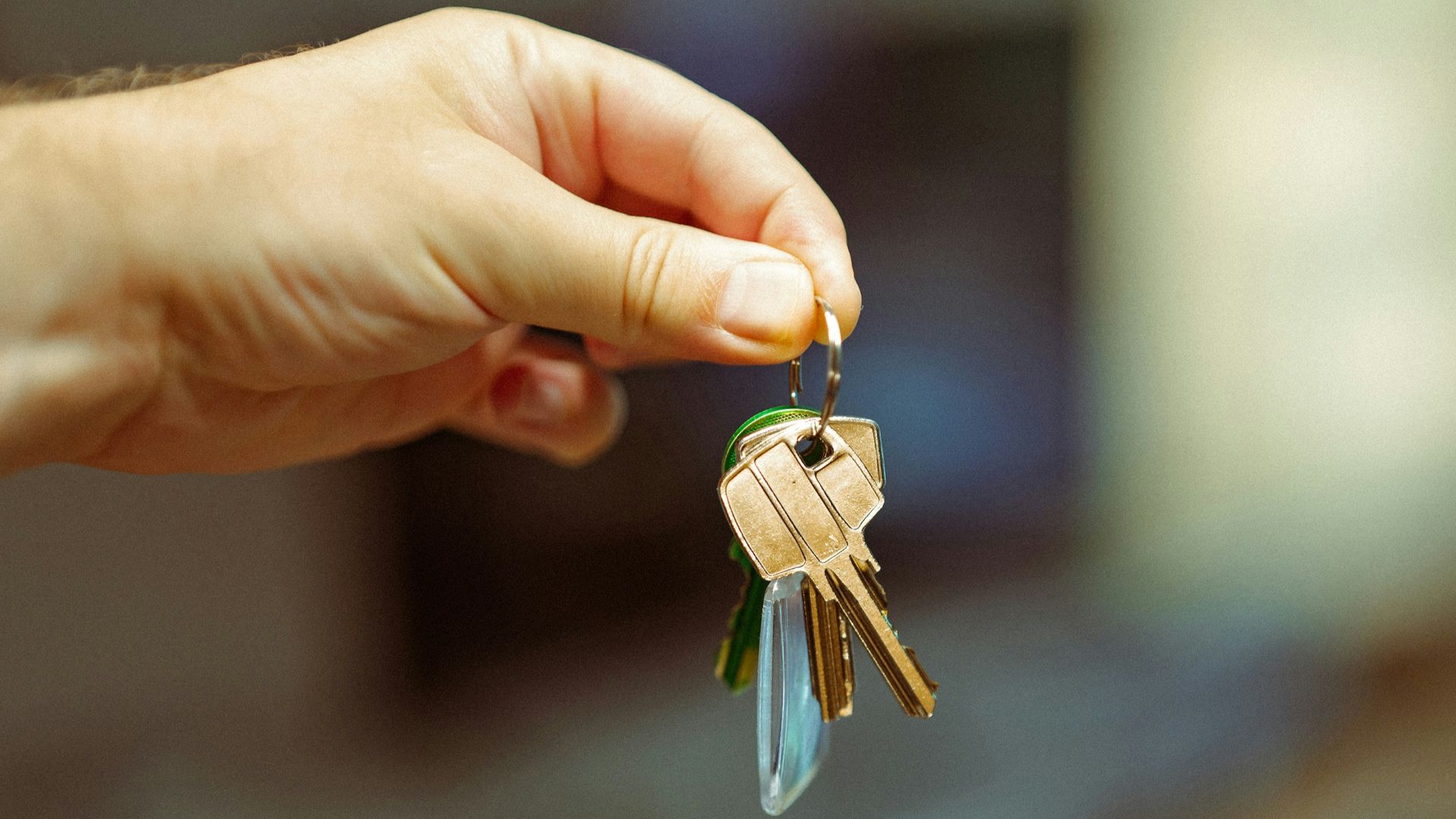 A person holding a bunch of keys in their hand
