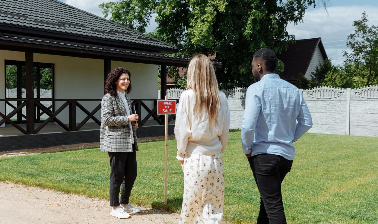 A diverse group viewing a house for sale