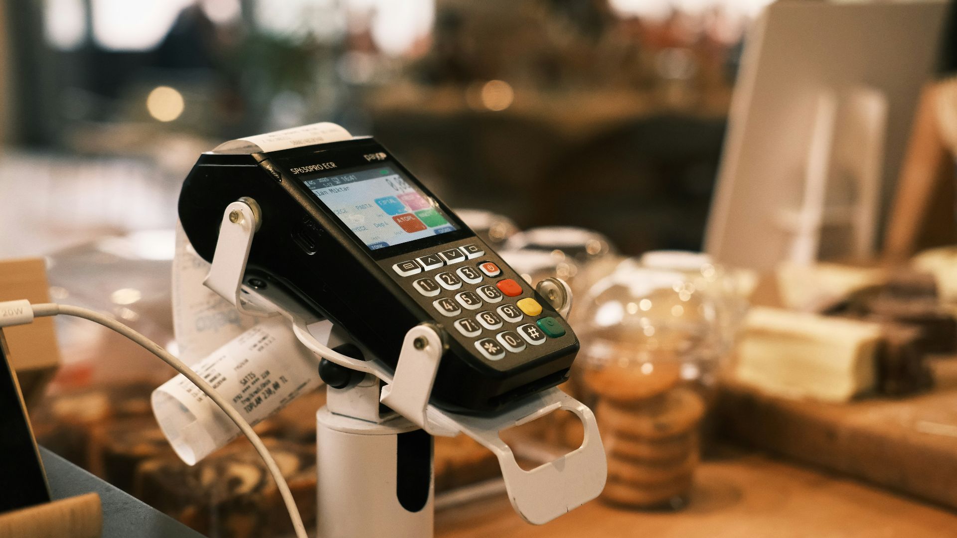 A cell phone is hooked up to a charger