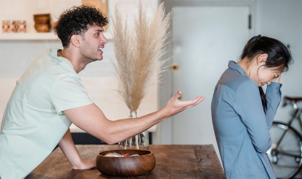 An intense argument between a couple indoors, depicting emotional distress and communication issues