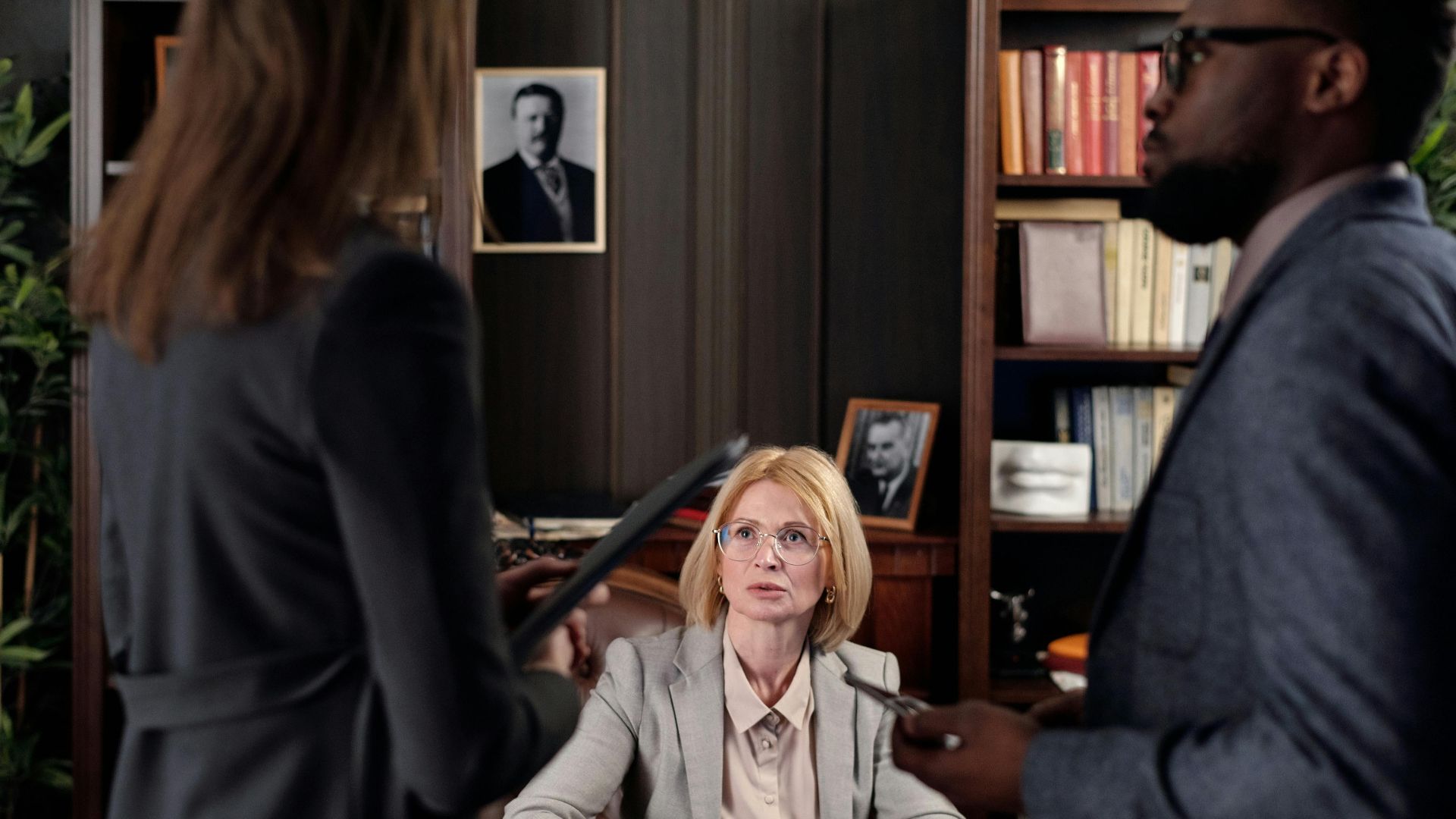Diverse team discussing strategies in a professional office setting.