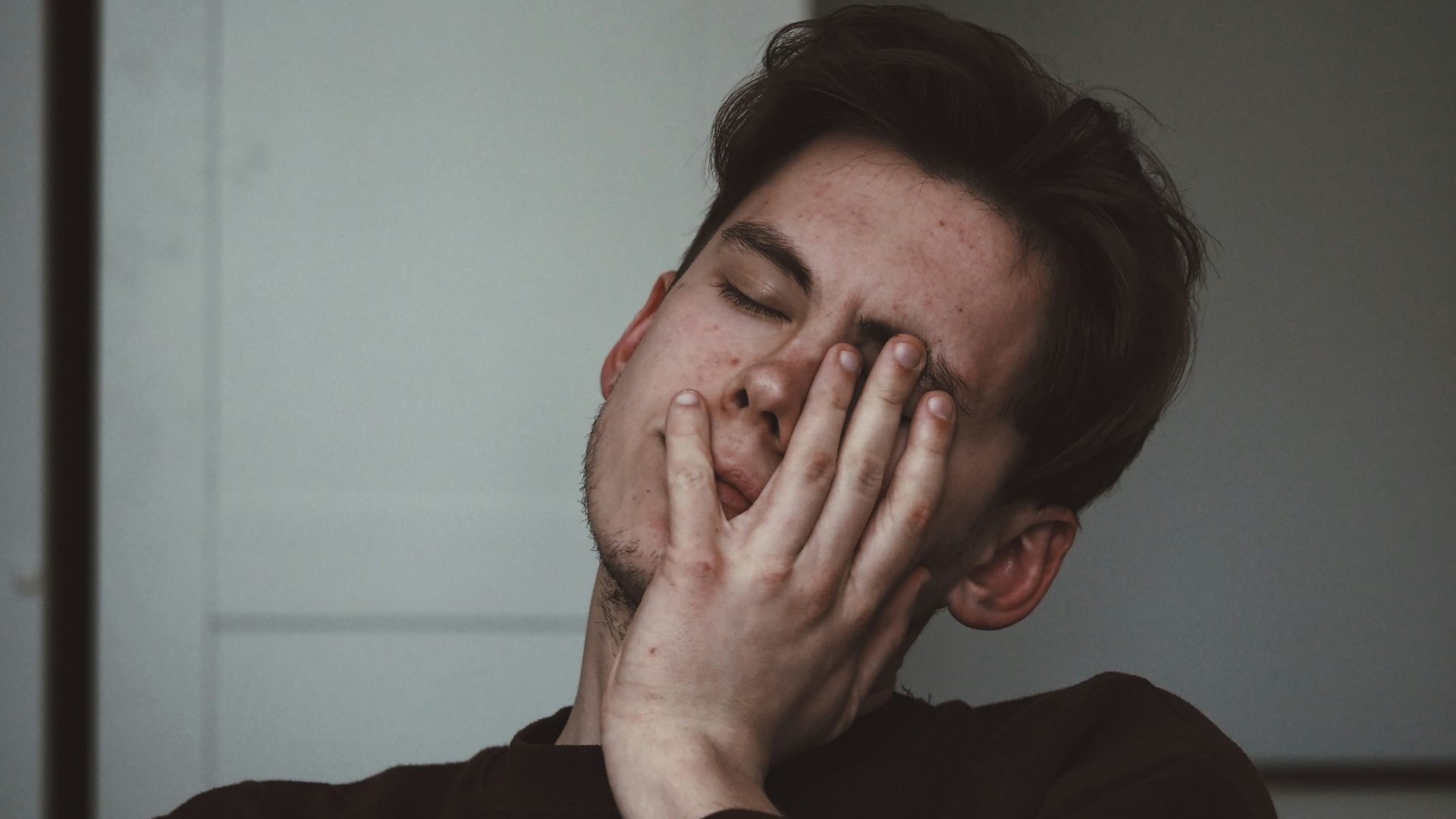 man wearing black crew-neck top