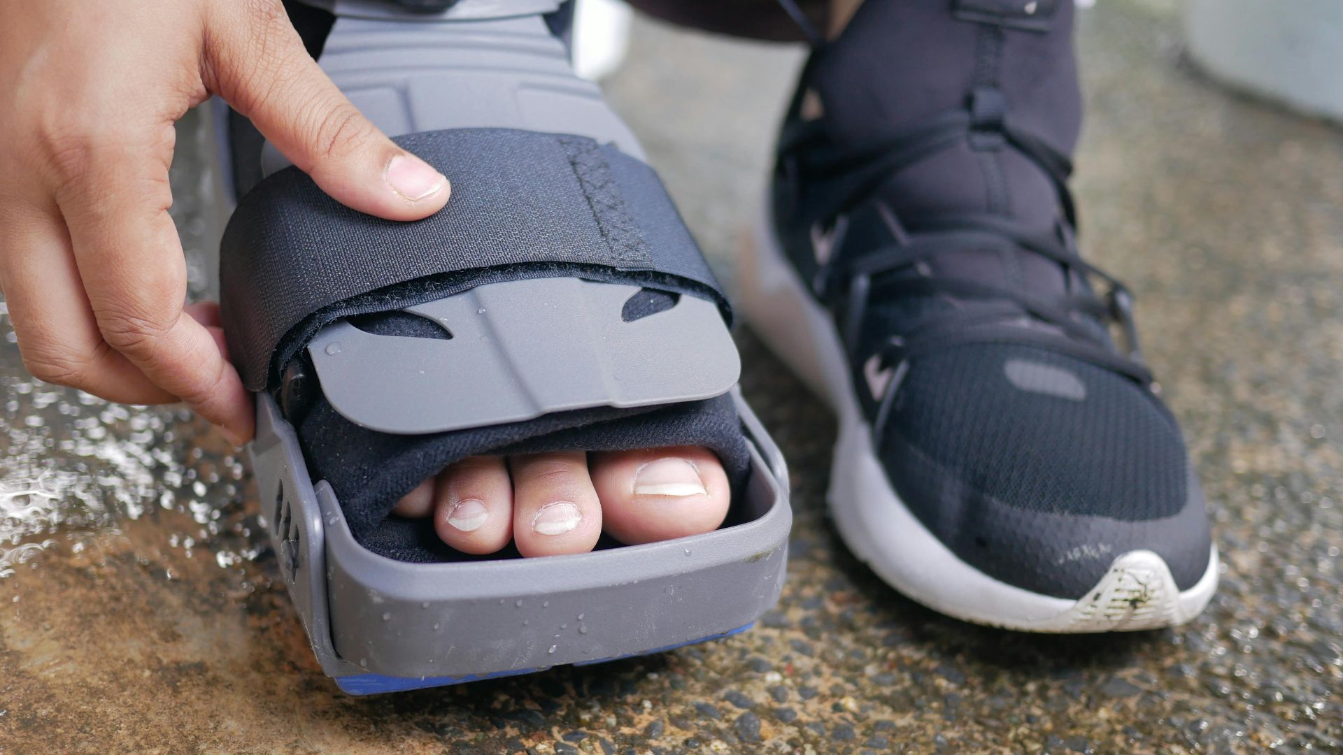 Detailed close-up of a foot in an orthopedic brace, highlighting post-injury recovery.