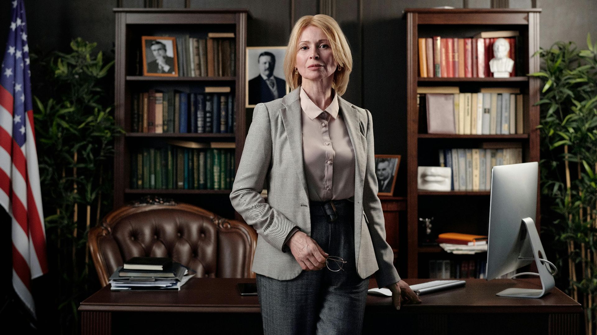 Portrait of a confident businesswoman standing in an elegant office setting.