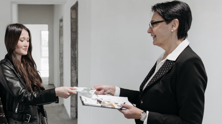 Real Estate Agent Showing House Plans