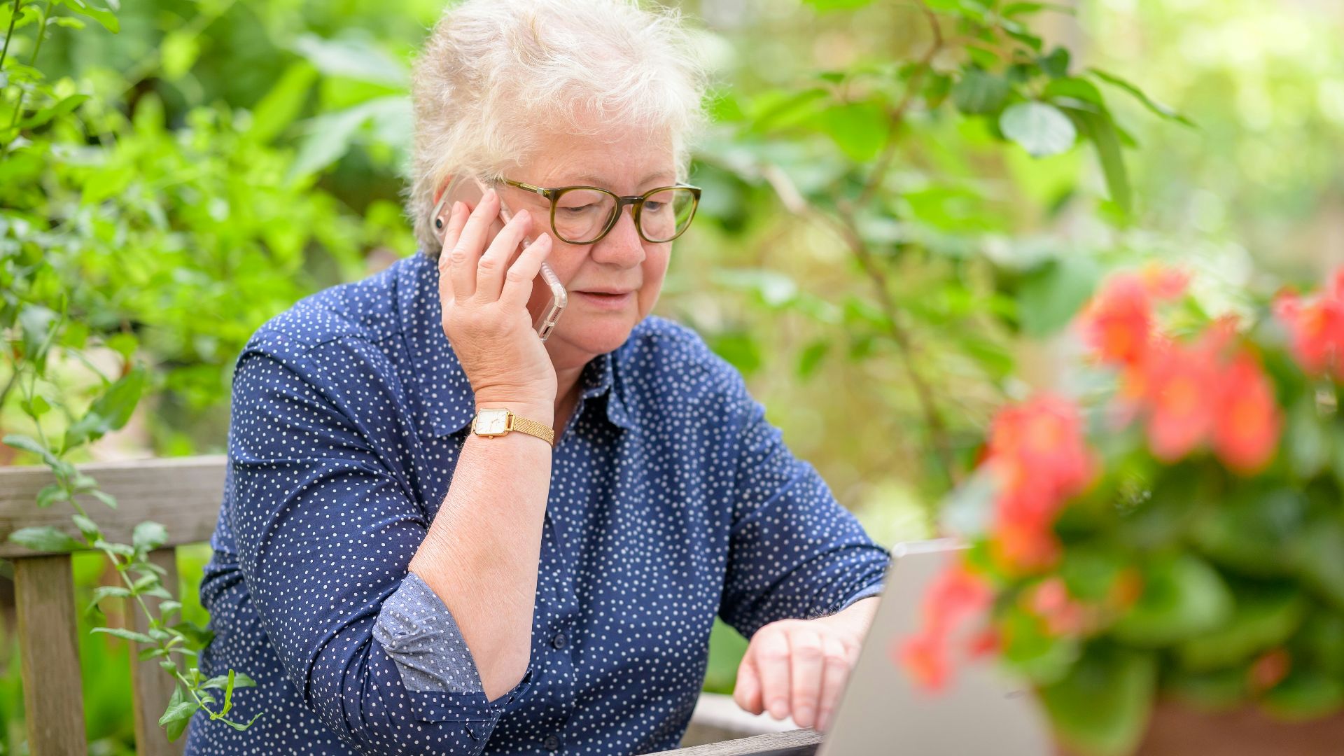 an old woman using a laptop