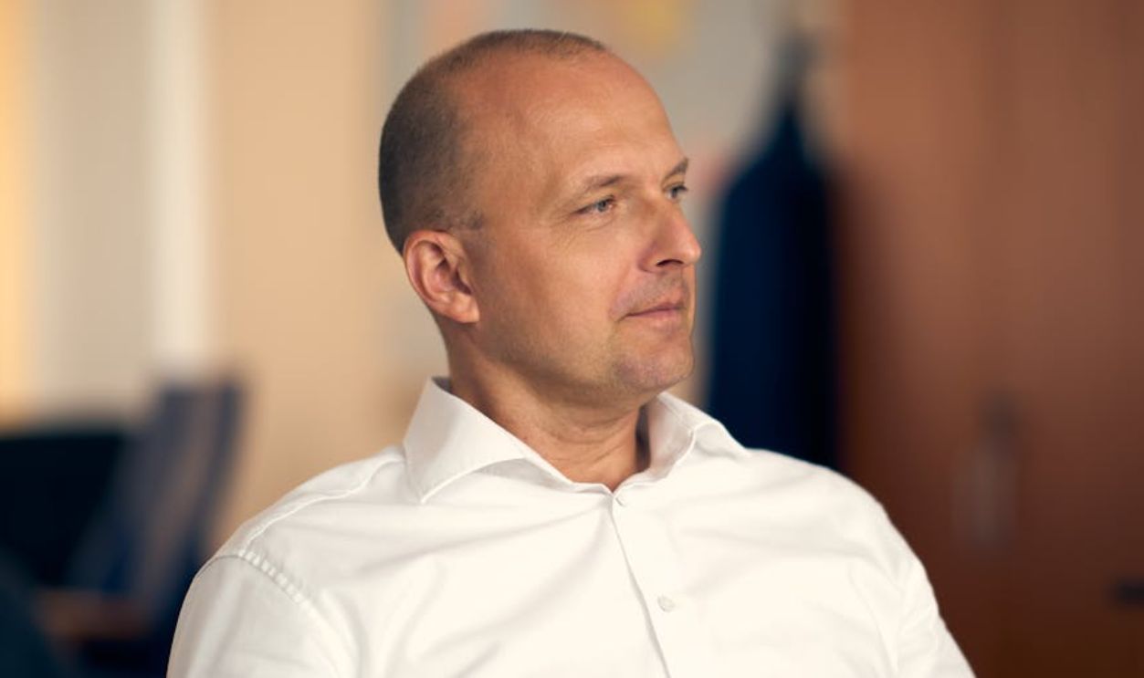 Professional portrait of a thoughtful businessman in an office setting in Bratislava, Slovakia